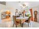 Bright dining room with tile floor, colorful tablecloth and view into kitchen at 197 Ebb Tide Cir, Las Vegas, NV 89123