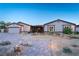 Charming single-story home featuring a desert landscape, attached garage and paved walkway to covered front entry at 197 Ebb Tide Cir, Las Vegas, NV 89123