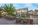 Exterior view of a greenhouse with brick planters and hardscape at 197 Ebb Tide Cir, Las Vegas, NV 89123