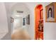 Elegant hallway with art niches, paintings, and carpet flooring at 197 Ebb Tide Cir, Las Vegas, NV 89123