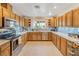 Spacious kitchen with stainless steel appliances, lots of counter space and wood cabinets at 197 Ebb Tide Cir, Las Vegas, NV 89123