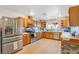 Spacious kitchen with stainless steel appliances, lots of counter space and wood cabinets at 197 Ebb Tide Cir, Las Vegas, NV 89123