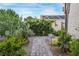 Lush desert landscaping along a stone pathway, featuring a variety of plants at 197 Ebb Tide Cir, Las Vegas, NV 89123