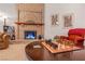 Relaxing living room with a decorative fireplace, chess set and comfortable seating at 197 Ebb Tide Cir, Las Vegas, NV 89123