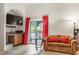 Comfortable living room featuring a wet bar and access to backyard at 197 Ebb Tide Cir, Las Vegas, NV 89123