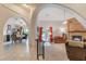Inviting living room featuring a decorative brick fireplace, arches to other rooms and sliding glass doors to the backyard at 197 Ebb Tide Cir, Las Vegas, NV 89123