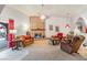 Cozy living room featuring a decorative brick fireplace, comfortable seating and natural light at 197 Ebb Tide Cir, Las Vegas, NV 89123