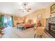 Bright, spacious primary bedroom featuring a fireplace, ceiling fan, and private patio access at 197 Ebb Tide Cir, Las Vegas, NV 89123