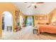 Sunny primary bedroom with patio access, a seating area, and walk-in closet at 197 Ebb Tide Cir, Las Vegas, NV 89123