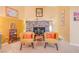 Relaxing primary bedroom area with a brick fireplace and comfortable seating at 197 Ebb Tide Cir, Las Vegas, NV 89123