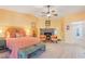Serene primary bedroom with fireplace, seating area, and ceiling fan at 197 Ebb Tide Cir, Las Vegas, NV 89123