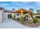 Backyard has an outdoor kitchen, covered patio, and manicured landscaping at 197 Ebb Tide Cir, Las Vegas, NV 89123