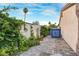 Paver stone patio with stucco wall with mature green landscaping at 197 Ebb Tide Cir, Las Vegas, NV 89123