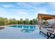 Private pool with hot tub, poolside lounging, and covered seating area at 197 Ebb Tide Cir, Las Vegas, NV 89123