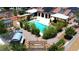 Inviting backyard oasis featuring a sparkling pool, covered patios, and lush greenery for ultimate relaxation at 197 Ebb Tide Cir, Las Vegas, NV 89123