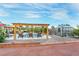 Inviting pool area features a covered pergola, lounge chairs, and a charming greenhouse at 197 Ebb Tide Cir, Las Vegas, NV 89123