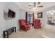 Cozy sitting area with red armchairs and natural light, great space for relaxing at 197 Ebb Tide Cir, Las Vegas, NV 89123