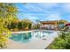 Beautiful swimming pool in a well-landscaped backyard with a covered patio and space for poolside lounging at 197 Ebb Tide Cir, Las Vegas, NV 89123
