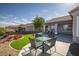 This is a backyard with outdoor seating and flower beds at 2099 Mountain City St, Henderson, NV 89052