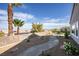 This is a landscaped backyard with a stone walkway and mountain views at 2099 Mountain City St, Henderson, NV 89052