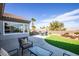 This is a backyard with a patio, lawn, flower beds and mountain views at 2099 Mountain City St, Henderson, NV 89052