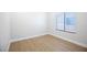 This is a simple bedroom with light colored vinyl floors and a window at 2099 Mountain City St, Henderson, NV 89052