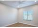 Clean bedroom featuring a window with blinds and a ceiling fan at 2099 Mountain City St, Henderson, NV 89052