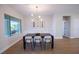 Cozy dining area with contemporary lighting and a view of the backyard at 2099 Mountain City St, Henderson, NV 89052