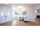 Bright and open foyer with stylish furniture and a modern light fixture at 2099 Mountain City St, Henderson, NV 89052