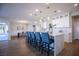 Open kitchen with a large island and seating, pendant lighting, and modern design at 2099 Mountain City St, Henderson, NV 89052