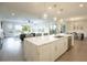 Open concept kitchen with a large island, marble countertops, and modern appliances at 2099 Mountain City St, Henderson, NV 89052