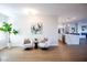 Bright living room with an open floor plan flowing to the kitchen and dining area at 2099 Mountain City St, Henderson, NV 89052