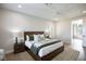 Cozy main bedroom with a large bed, soft lighting, and view to the main bathroom at 2099 Mountain City St, Henderson, NV 89052