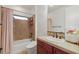 Bathroom featuring tile surround tub and single sink vanity at 2240 Boutique Ave, Henderson, NV 89044