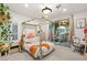 Bright bedroom with a canopy bed, sliding glass door and an ensuite bath at 2240 Boutique Ave, Henderson, NV 89044
