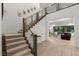 Grand foyer with staircase leading to the upper level and open view to the living area at 2240 Boutique Ave, Henderson, NV 89044