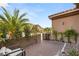 Well-manicured front yard with lush landscaping, a private courtyard, and a cozy seating area, perfect for relaxation and entertaining at 2240 Boutique Ave, Henderson, NV 89044