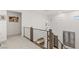 Bright hallway featuring modern railings and contemporary lighting fixtures, offering a clean aesthetic at 2240 Boutique Ave, Henderson, NV 89044