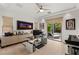 Well-lit home office with modern desk, and seamless access to the outdoor pool area at 2240 Boutique Ave, Henderson, NV 89044