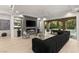 Stylish living room with a linear fireplace and sliding doors leading to the pool and patio at 2240 Boutique Ave, Henderson, NV 89044