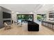 Open-concept living room features hardwood floors, fireplace, and seamless indoor-outdoor flow at 2240 Boutique Ave, Henderson, NV 89044