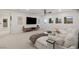 Spacious and comfortable living room with a large sectional sofa and ample natural light at 2240 Boutique Ave, Henderson, NV 89044