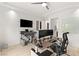 Bright office space featuring modern desk setup, tv, and lots of natural light at 2240 Boutique Ave, Henderson, NV 89044