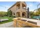 Backyard kitchen area with a built-in grill and a view of the two-story home at 2240 Boutique Ave, Henderson, NV 89044