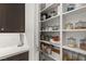 Organized pantry with shelves for food storage at 2240 Boutique Ave, Henderson, NV 89044