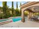Inviting backyard pool and spa with covered patio and outdoor dining area offer resort-style living at 2240 Boutique Ave, Henderson, NV 89044