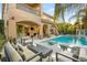 Resort-style pool area with loungers and a view of the home's architecture at 2240 Boutique Ave, Henderson, NV 89044