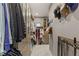 Spacious walk-in closet with custom shelving and hanging racks for organizing clothes and accessories at 2240 Boutique Ave, Henderson, NV 89044