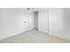 Bedroom featuring neutral carpet, white walls, closet, and door to hallway at 2801 Emmons Ave, North Las Vegas, NV 89030