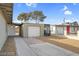 Exterior view of detached garage and the side of the home. The yard is gravel at 2801 Emmons Ave, North Las Vegas, NV 89030